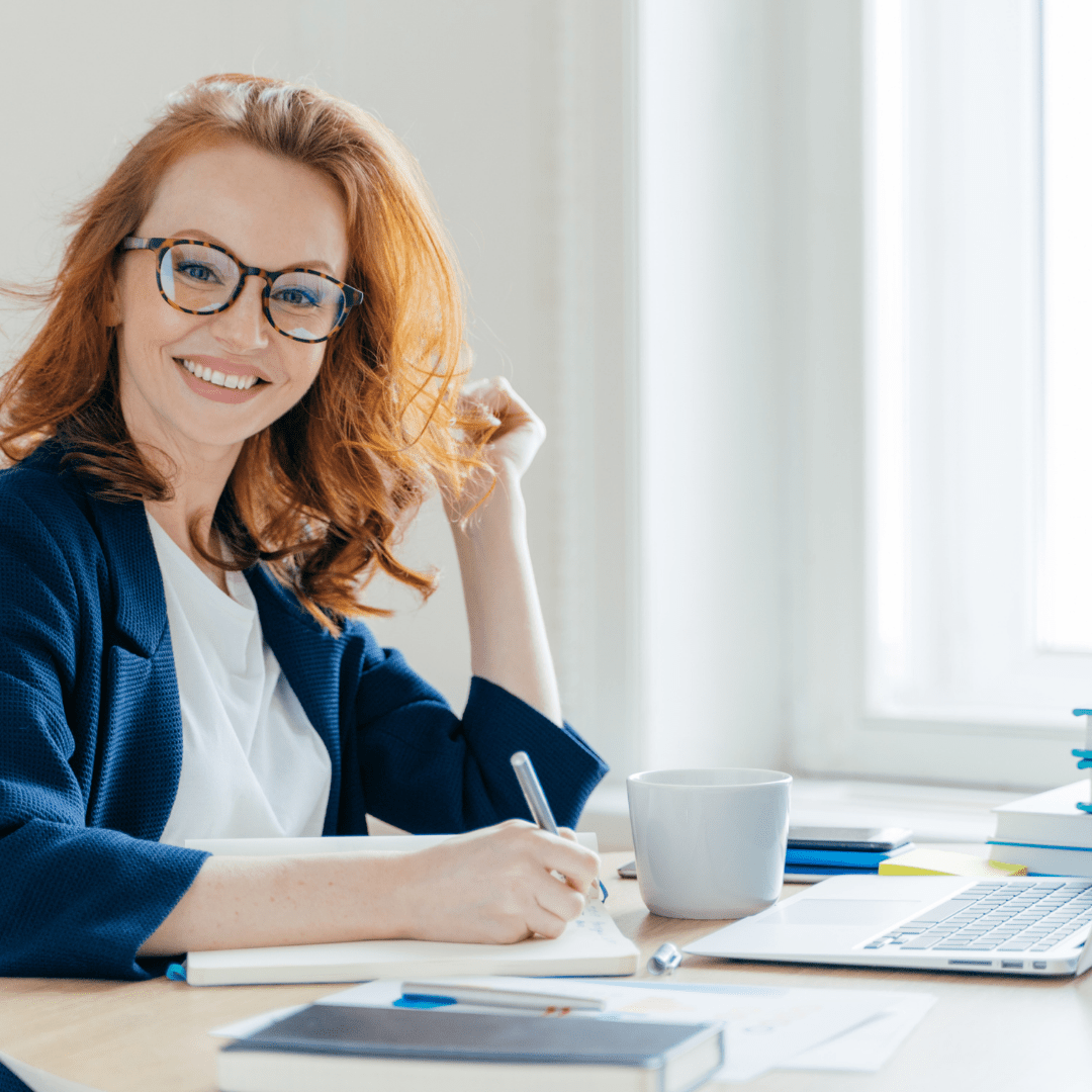 Red-haired woman analyzes data and makes accounting report